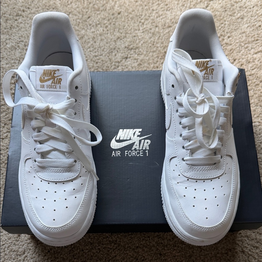 Nike White Air Force 1 Low with Gold Tongue Logo